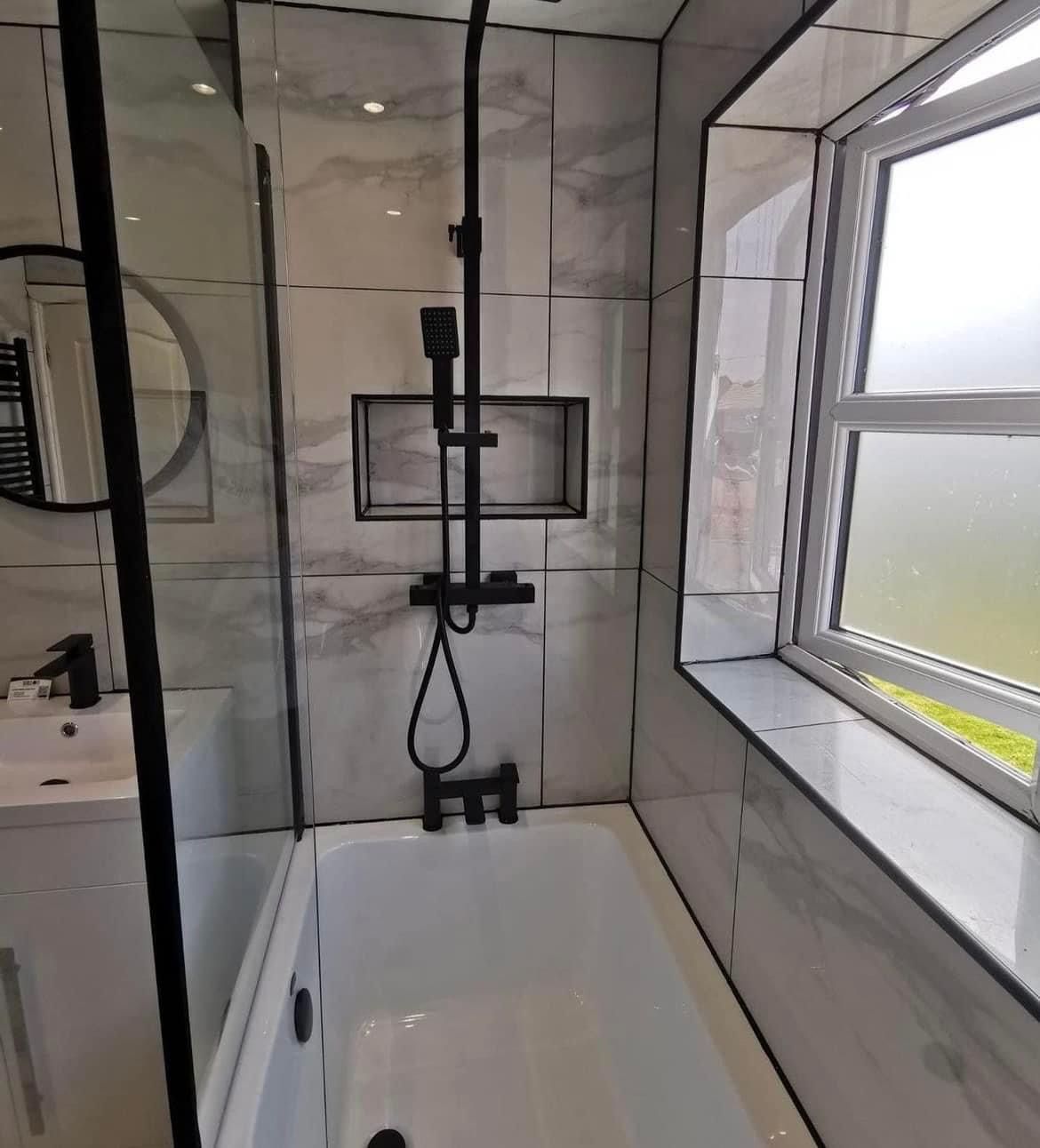 Shower bath with black fittings