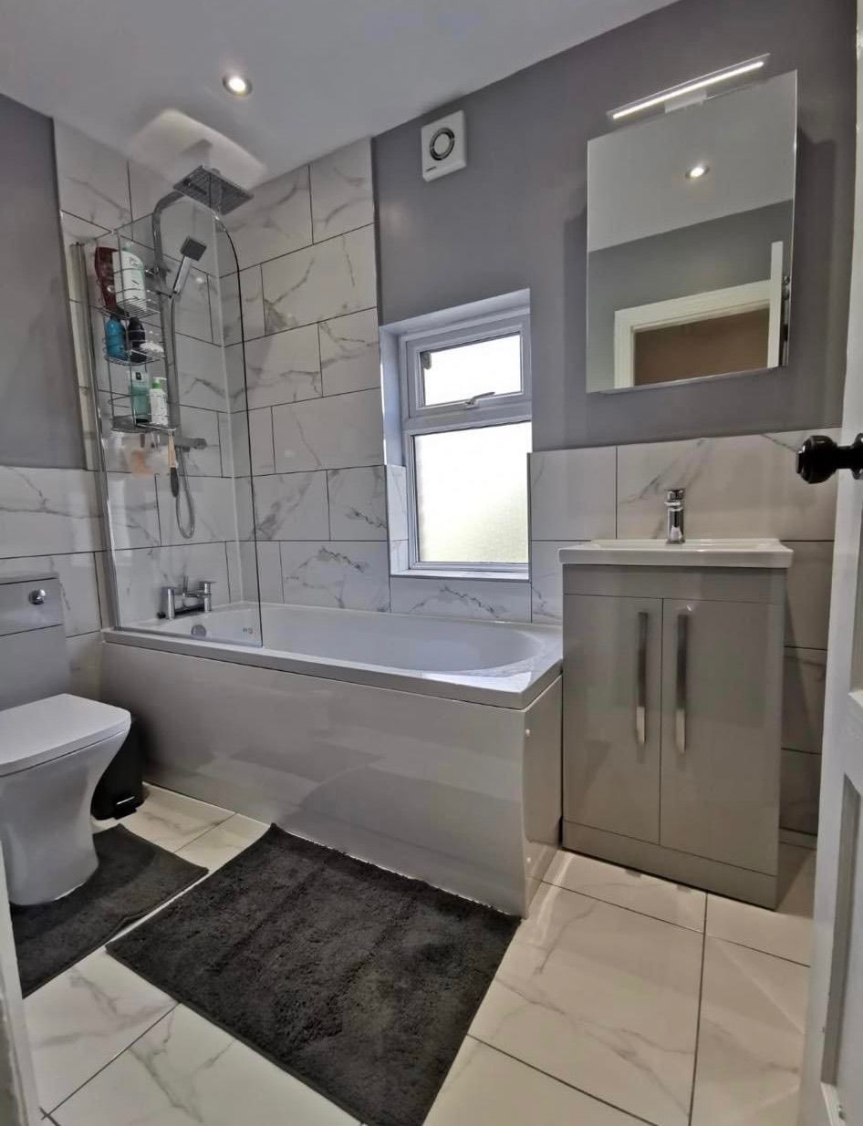 Grey and white family bathroom