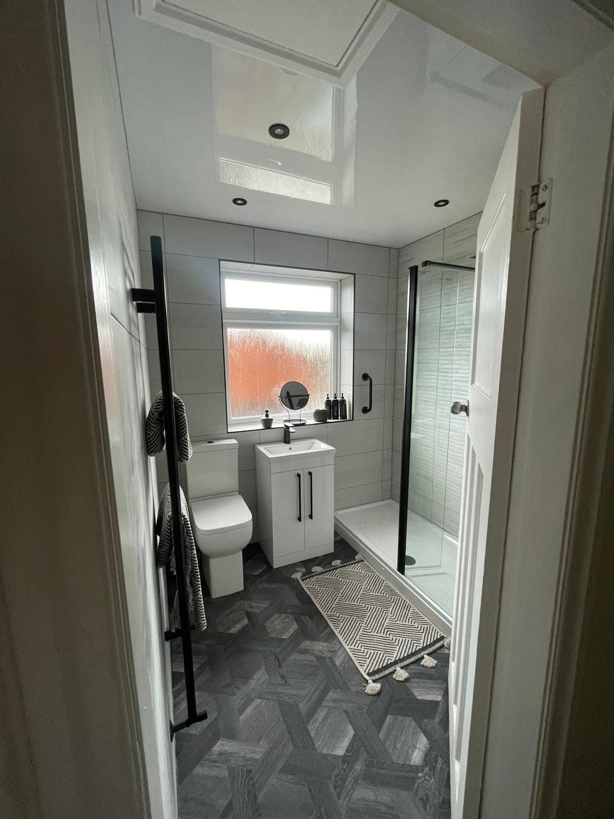 En-suite with a black-framed screen